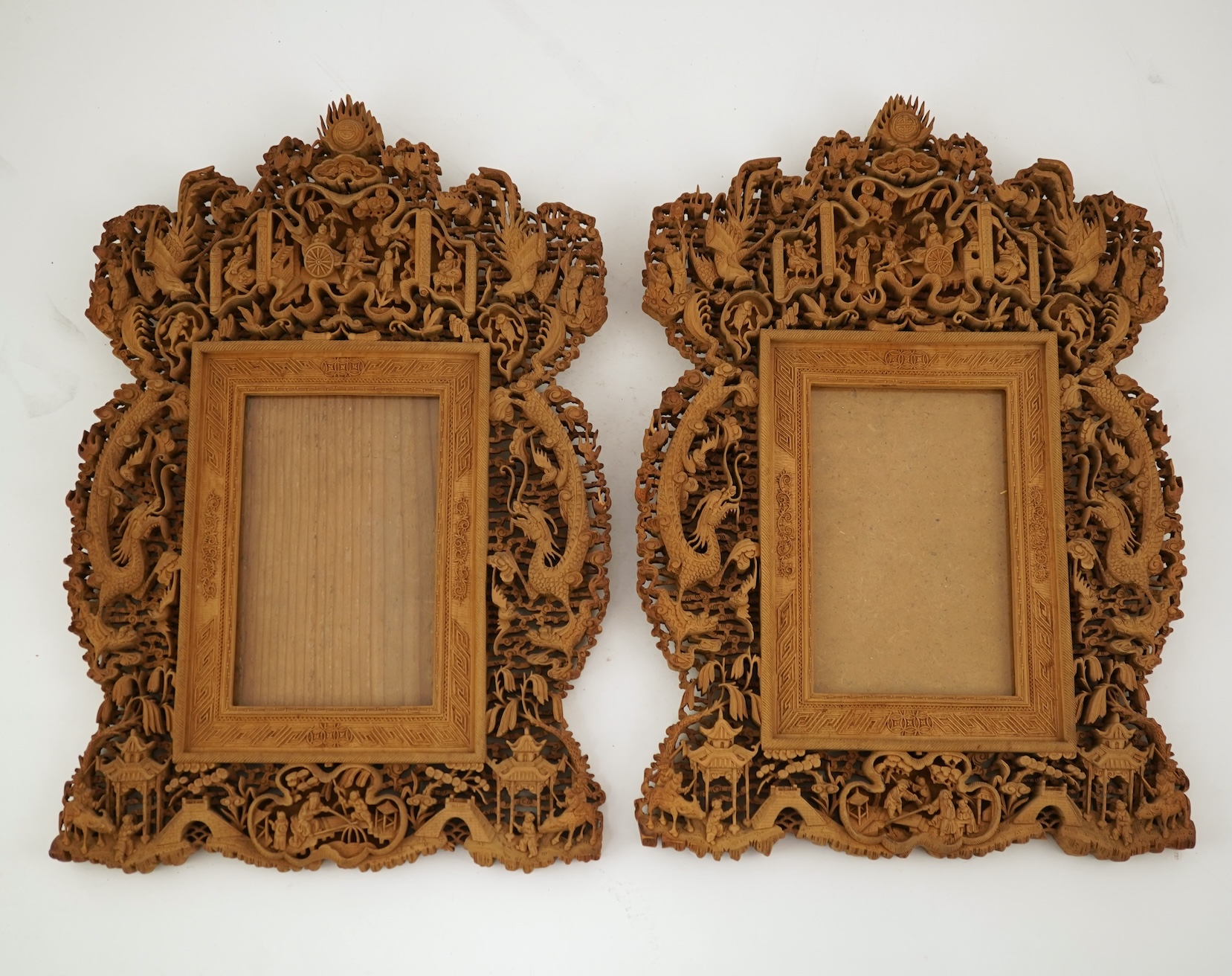 A pair of Chinese carved sandalwood frames, late 19th century